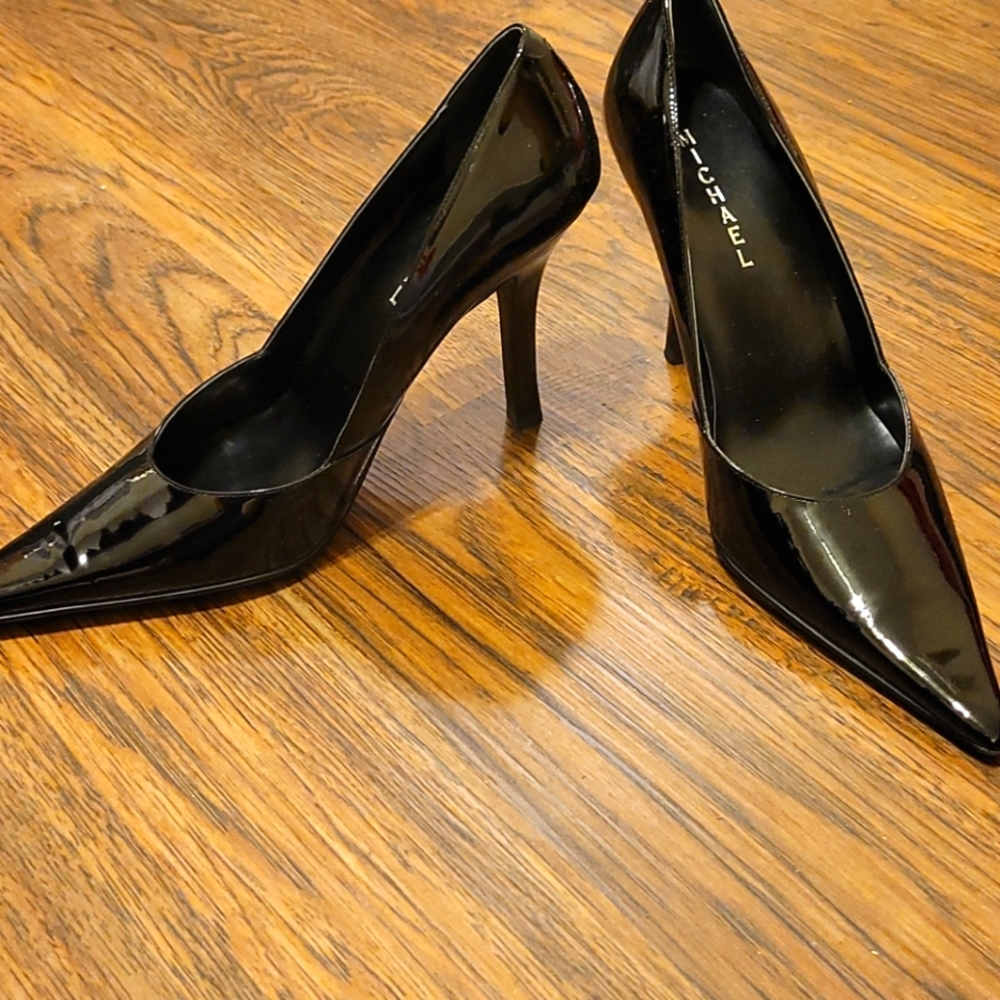 Black patent leather stiletto pumps
